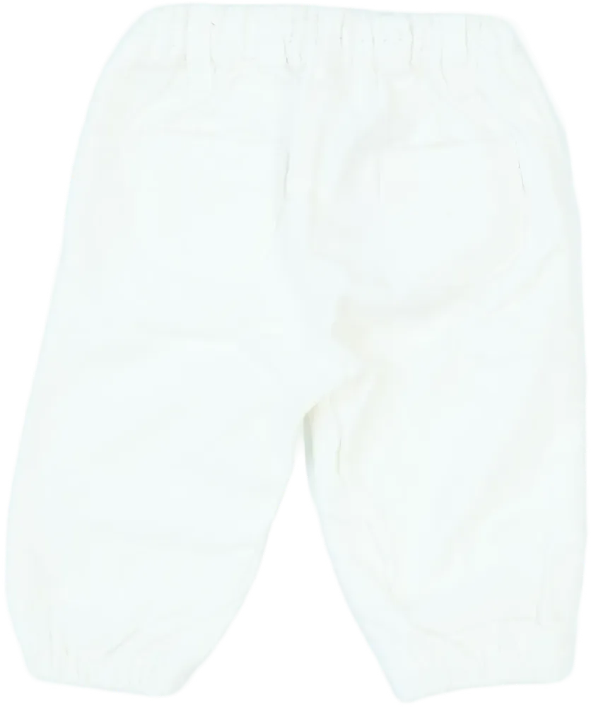 Fehér Benetton Baby nadrág EU 74 / UK 6-9 hónap / US 6-9 hónap